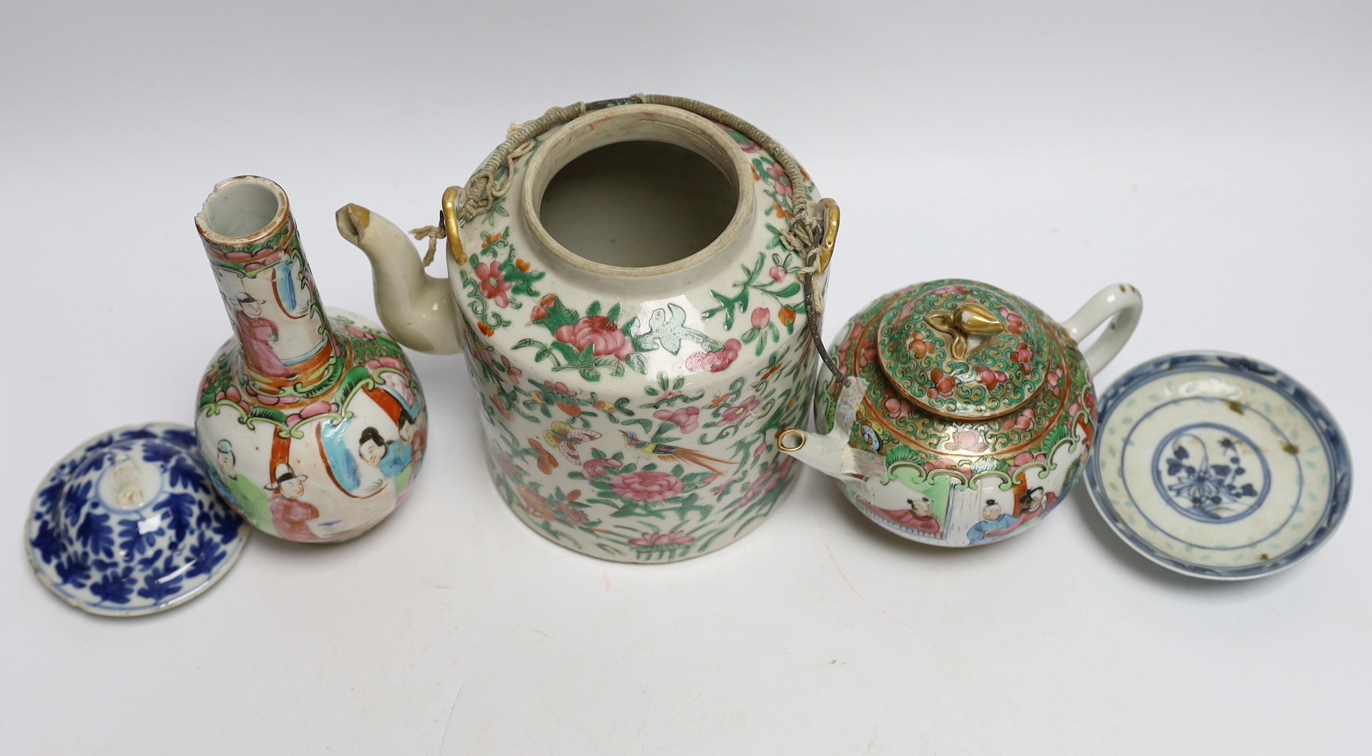 A collection of Chinese and Japanese ceramics including two famille rose teapots, a vase, four saucers, etc. (8)